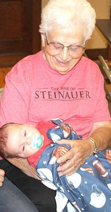 Roselyn Jasa (greatgranddaughter of Joseph Steinauer) holds her great grandson, Camden Sudik.
