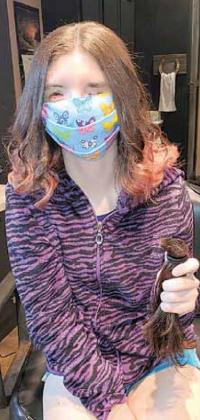 Madison Plager gets ready to donate her hair.