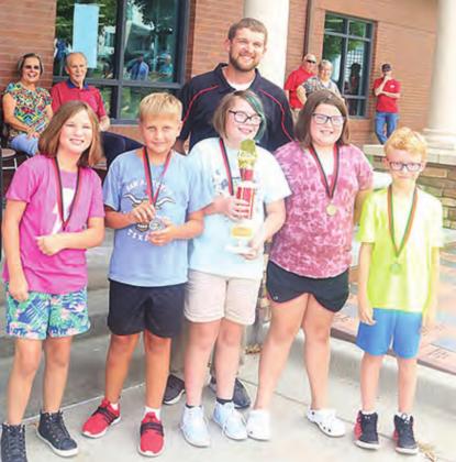 These fifth graders read 472 books total in the Summer Reading Program, besting everyone else. They get a trophy now to keep in their room. They are pictured with their teacher, Hadley Sejkora. From left, Addison Boverhuis, Derek Porter, Bella Thompson, Lila Yunghans, Zeke Ferebee. Ray Kappel/Republican