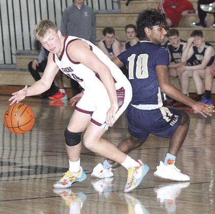 LHS’ Everett Bohling (#10, left) fakes out his OCA opponent on his way down the court. Bohling scored 20 points to lead the Tigers in Saturday’s game. Paula Jasa/Republican