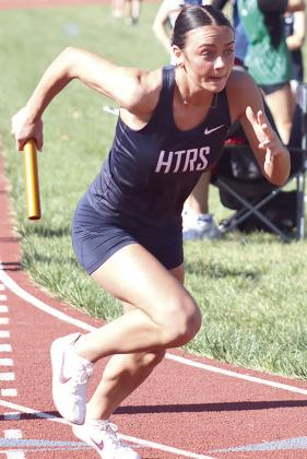 HTRS’ Lillian Bowen’s quick start in the 1600 M. relay helped earn the Lady Titans a silver medal. Paula Jasa/Republican