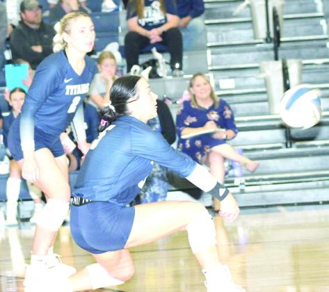 HTRS’ Lillian Bowen (#5) directs a pass to the front row as teammate Elie Bstandig (#2, left) looks on in a three-set match against E-M-F last Monday at the Pioneer. Paula Jasa/Republican