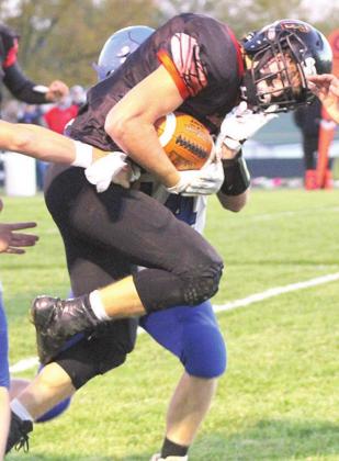 Pawnee City’s Kyle Gyhra fights for extra yardage while breaking tackles against Wallace on Friday night. Paula Jasa/Republican
