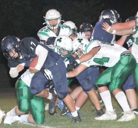 HTRS’ Aiden Worthey (#17) bulls his way forward as FCSH defenders try to take him down in the middle of the field. Paula Jasa/Republican