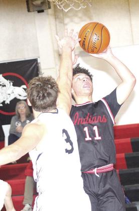 P.C.’s Darius Andersen (#11, right) goes up for a bucket underneath in Saturday consolation action. Paula Jasa/Republican