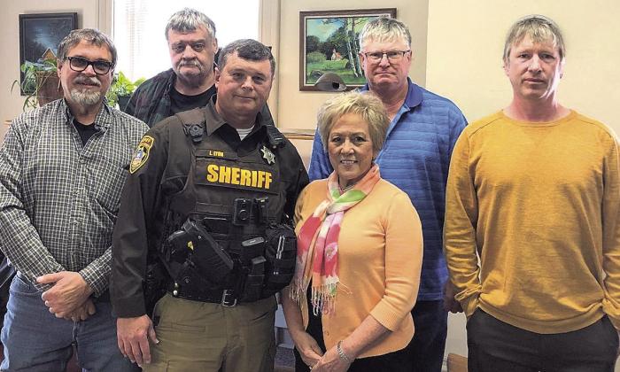 Pictured above: Dave Borrenpohl, Chairman of the Board, Les Agena Commissioner, Sheriff Lynn Lyon and his wife Mary Lyon, Tim Weber Commissioner, and County Attorney Ben Beethe.