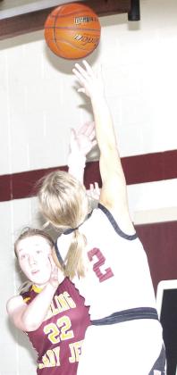 LHS’ Justice Currie (#2, right) goes up for a fast break shot against Sterling. Justice scored 13 points against Sterling on Parents’ Night. Paula Jasa/Republican
