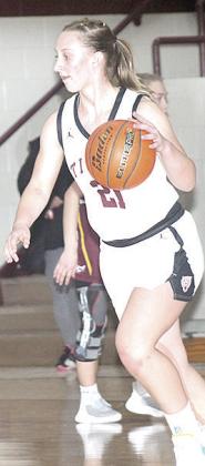 LHS’ Maddie Janssen (#21) drives the lane against Sterling. Paula Jasa/Republican