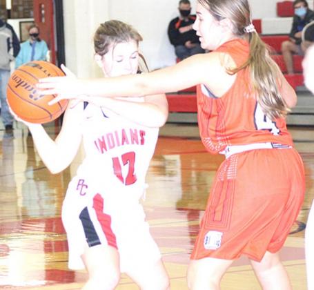 P.C’s Olivia Gottula (#12, left) brings down the ball against the Lady Griffins with some resistance. Paula Jasa/Republican