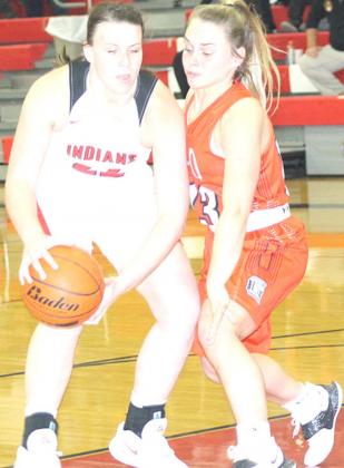 P.C’s Austin Branch (left, #22) goes tough in the paint. Branch scored four points inside. Paula Jasa/Republican