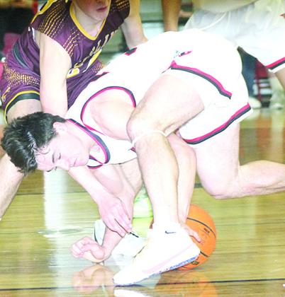 P.C.’s Jett Farwell fights for a loose ball against Sterling on Friday night. Paula Jasa/Republican