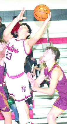 P.C.’s Anthony Kling (#23, center) gets pushed from behind on a layup attempt against Sterling. Paula Jasa/Republican