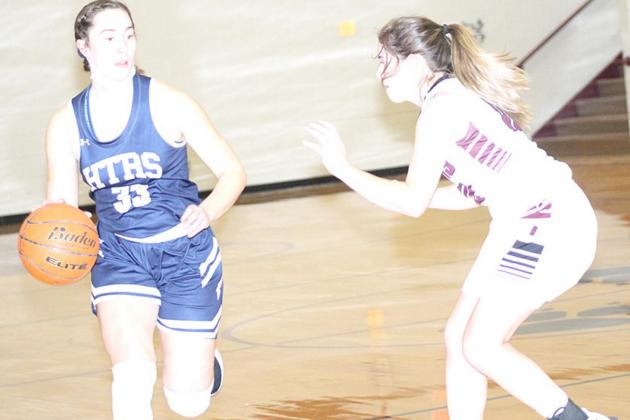 HTRS’ Natalie Novak (#33, left) brings the ball down the floor against Lewiston’s Masyn Arena (#10, right). Paula Jasa/Republican