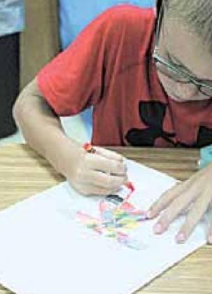 3rd Grader Dalton Heideman working on his optical illusion artwork.