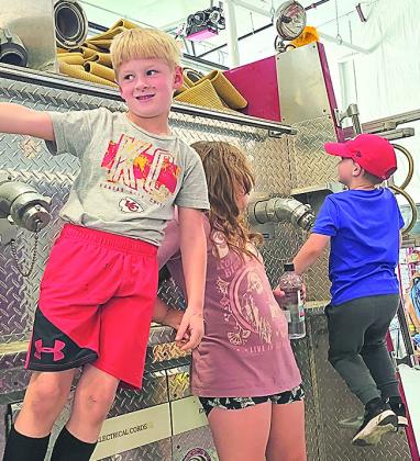 Pawnee City kindergarten,1st and 2nd grade students had school tour of the new firehouse in Pawnee City which officially opened in the spring of 2022. It was a noisy affair as the chidren honked horns and tried to get the fireman to let them spray cars driving by on Hwy 50 with the firehose. The children enthusistically lined up for cans of pop which were handed out by firemen Lynn Curtis,Justin Morehead,Brady Johnson,and JonVetrovsky.