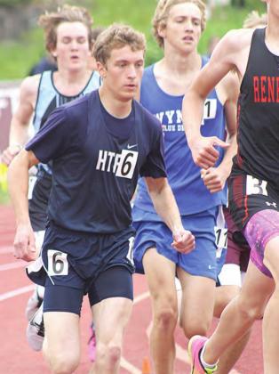 HTRS’ Will Stalder (left) rounds the corner in his heat of the Class D boys’ 800 M. Run. Paula Jasa/Republican
