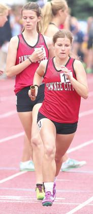 P.C.’s Olivia Gottula takes the handoff from teammate Mallory Branek in the Class D girls’ 3200 M. Relay. photo courtesy of Lorrie Novak