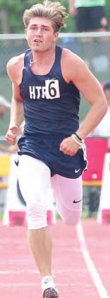 HTRS’ Jayden McNealy runs his prelim heat of the boys’ 100 M. Dash. photo courtesy of Lorrie Novak