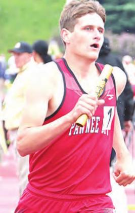 P.C.’s Bryce Gyhra takes the curve of the 3200 M. Relay. photo courtesy of Stephanie Croston