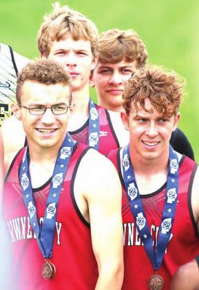 P.C.’s Kyle Gyhra, (back left), Kaden Lang (back right), Jacob Lytle (front left) and Andy Maloley (front right) display their 1600 M. 5th place relay medals. photo provided by Lorrie Novak