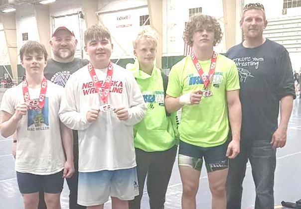 Junior High Club Wrestlers are from left: Ryan Hays [PC], Coach Cory Thompson, Gauge Schuetz [HTRS], Kashton Ries [PC], Drayven Lamb [HTRS], Coach Jacob Schuetz.