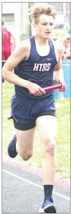 Paula Jasa/Republican HTRS’ Will Stalder runs his leg of the 3200 M. Relay.