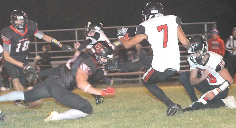 P.C.’s Andy Maloley (left) blocks a field goal attempt by Meridian in the first half. Paula Jasa/Republican