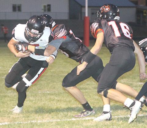 P.C.’s Hunter Johnson makes a terrific tackle in the backfield against Meridian as teammate Anthony Kling (#16, right) looks to help out. Paula Jasa/Republican