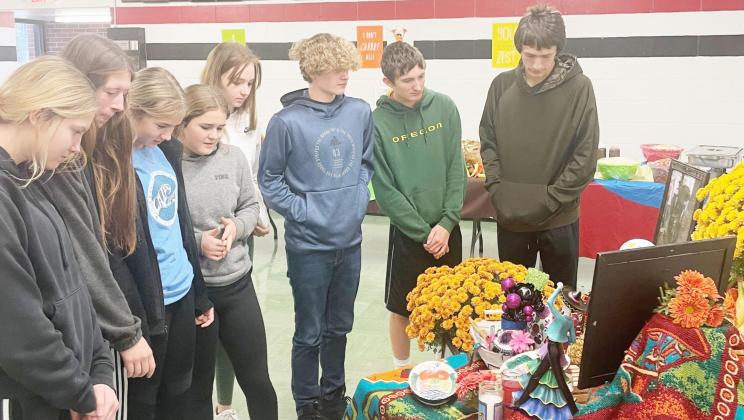 Members of the Spanish class look over the altar prepared for the Day of Dead celebration at Pawnee City High School. From left: Kennadie Benson, Hallye Friedly, Madison Fender, Emma Meints, Ariana Fetherkile, Jackson Glass, Zachary Wenzl, Hunter Johnson