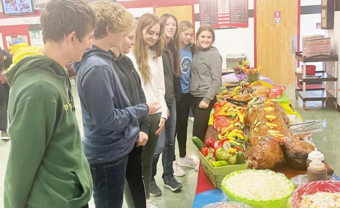 Members of the Spanish class view the table set for the Day of the Dead celebration at Pawnee City High School From Left: Zachary Wenzl, Jackson Glass, Kennadie Benson, Ariana Fetherkile, Hallye Friedly, Madison Fender, Emma Meints--