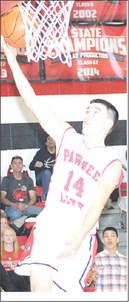 P.C.’s Jett Farwell (#14) scores on a steal and a layup late in the game against Diller/Odell. P.C. won the game by a thrilling 50-49 score. Paula Jasa/Republican
