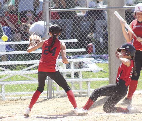 P.C.’s Mercy McLaughlin (#22, right) slides in safely at home plate to make it 8-2 in the bottom of the 3rd while teammate Lilah Yunghans (far right) looks on. Paula Jasa/Republican