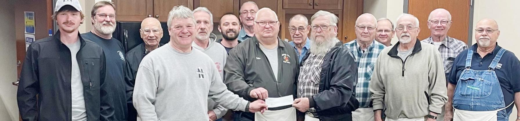 The Masonic Lodge of Pawnee City donated $25,000 to the new fire station. The money will be used for inside work at the station. The check was presented at the Monday night City Council meeting. On hand for the presentation were, from left, Kenneth Klepper, Russ Smith, Gerald Snyder, Mike Habegger, Scott Hanna, Dr. Kent Niss, Leonard Steiner, John Vetrovsky, Gary Bedea, Ed Raper, Ron Leitschuck, Jerry Vrtiska, Charlie Hatfield, Dan Boellstorff, and Ric Helms. Ray Kappel/Republican