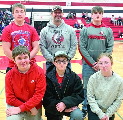 The Pawnee City Wrestling team was also recognized at the Pawnee City vs. HTRS Basketball game on Parent’s/Senior Night on Tuesday, January 16th. Pictured are front, from left: Justin Baehr, Luke Hunzeker, Kaylee Turnbull. Back row: Jesse McLaughlin, Head Coach Shane Maloley, Dylan Layne. Paula Jasa/Republican