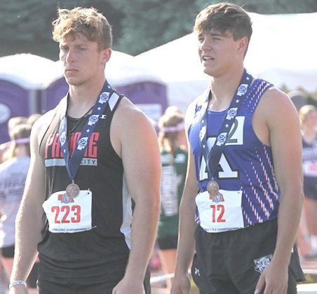 P.C.’s Andy Maloley (left) on the podium for 8th in the 100 M. Dash. (photo courtesy of Stephanie Croston)