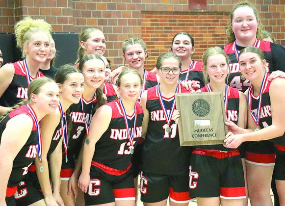 GIRLS’ CLASS B MUDECAS RUNNER-UP - Members of the Pawnee City girls’ basketball team proudly display their Class B Mudecas Runner-up trophy after their only loss to the #1 seeded Palmyra Lady Panthers on Friday. Paula Jasa/Republican