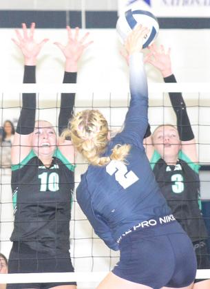 HTRS’ Elie Bstandig (#2, center) powers an attack off the hands of a FCSH blocker in Tuesday night’s game. Paula Jasa/Republican
