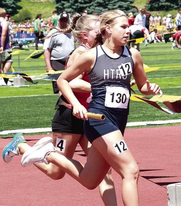 HTRS’ Laramie Glathar stays one step ahead of the competition in the Class D girls’ 3200 M. Relay. Photo courtesy of Lorrie Novak
