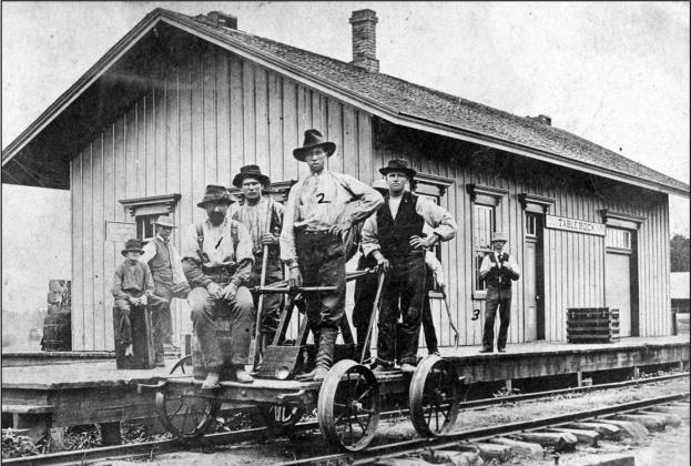 The Table Rock Depot in 1876, the year that C. W. Chambers became the depot agent. He was 23 years old. Chambers is the gent labeled as #3. #1 is Ed Ryan, who was a section chief, and #2 is Nick Goodenkauf. No one else is identified. This photograph is displayed in the Table Rock Train Museum. You can get a tour of that and other museums by calling Suzanne Ellis, 816-853-2442.