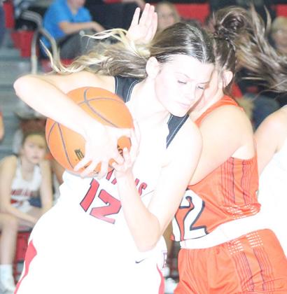 P.C.’s Mallory Branek (#12, left) pulls in a defensive rebound against Diller/Odell. Paula Jasa/Republican