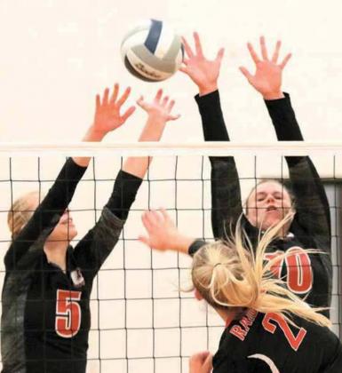 P.C.’s Sierra deKoning (#5, left) and Austin Branch (#10, right) go up for a block against Wymore Southern. photo courtesy of Lorrie Novak