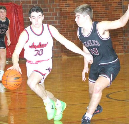 P.C.’s Jett Farwell (#30, right) brings up the ball against tough pressure in Saturday night’s game. Paula Jasa/Republican