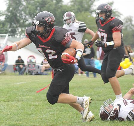 P.C.’s Andy Maloley (#12, center) takes off on big run down the sidelines as teammate Joey Marteney (#27, right) trails behind. Maloley had 5 carries for 216 yards. Paula Jasa/Republican