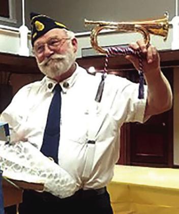 Gregg Clement, Post Adjutant, shows replica Civil Era bugles awarded to Doug and Trent Phillips of Humboldt for their years of