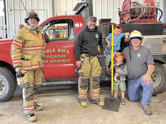 Head Start visits the Table Rock Fire Department, with volunteer firefighters Richard Sitzman, John Ticnor, and Fire Chief Den Schaardt. Shared by Chief Schaardt.