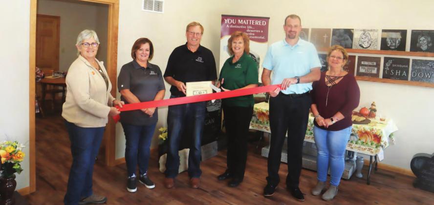 River Valley Memorials in Pawnee City had its Grand Opening Friday. Attending the ribbon cutting were from left Gail Howard, Cindy DeFreece, owners Bill and Mary Lyn Kruger, Chamber of Commerce President Brian Rottinghaus and City Clerk Tammy Curtis.