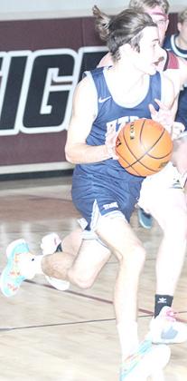HTRS’ Arthur Penisson (#10) takes off on a fast break against Lewiston. Paula Jasa/Republican