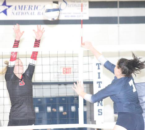 HTRS’ Hannah Koziol (#7, right) powers a spike past a Meridian blocker on Thursday night. Koziol had 5 kills and 34 digs in the match. Paula Jasa/Republican