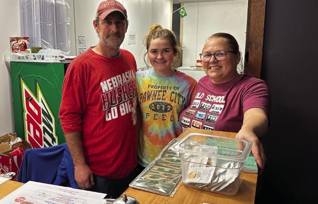 It’s a family affair! Arlan and Bobbie Meints take a break after the dinner rush at The Shop with their oldest daughter, Emma. All three of their daughters help with the restaurant and food truck when their school schedules allow.