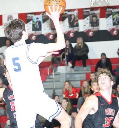 HTRS’ Jack Hunzeker (#5, left) goes in for a shot over P.C.’s Simon Osborne (#35, right). Hunzeker didn’t make any two-pointers, but he hit 6 treys for 18 points in the Titans’ win over Pawnee City on Friday night. Paula Jasa/Republican